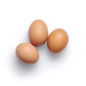a picture of three brown eggs
